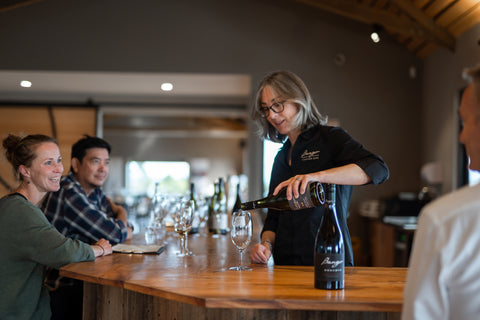 Friendly wine tasting at our beautiful wooden bar, Bangor Vineyard Shed, Tasmania.