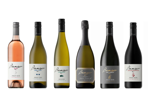 Six bottles of Bangor wine arranged in a row on a white background. Mix 6 pack of award winning Tasmanian white and red wine.