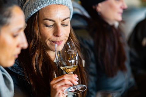 A lady wine tasting at Bangor Vineyard, Tasmania