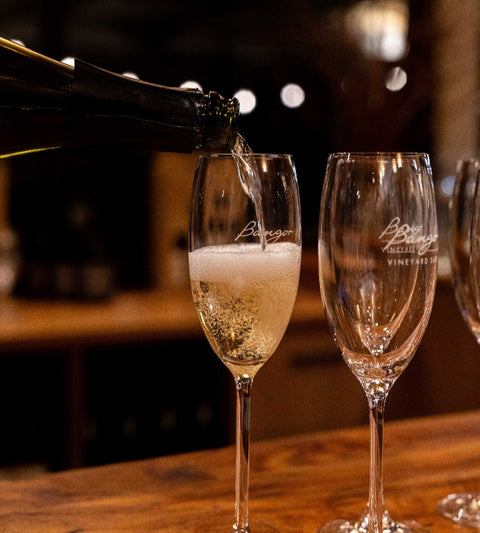Bangor Tasmanian Sparkling wine being poured into a glass with a blurred background
