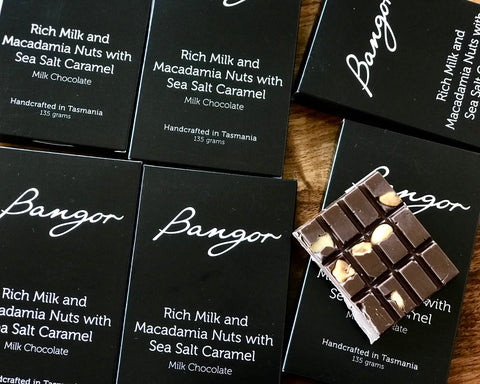 Bangor chocolate bars with sea salt caramel flavor on a wooden surface. Handmade Tasmanian chocolate, a perfect gift.