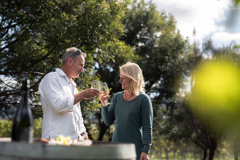 Two people enjoying food and wine tasting in Bangor Vineyard