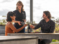 People enjoying a wine tasting outdoors on the deck at Bangor Vineyard Shed, Tasmania.