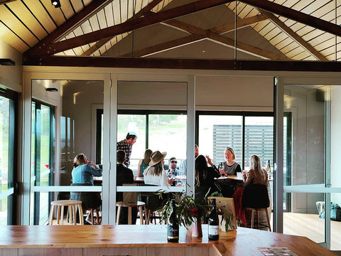 People enjoying a separate space in our private wine room. Creating quiet spaces in Bangor Vineyard Shed for people with sensory issues.