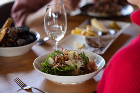 Bowl of salad, bowl of mussels, and a tasting plate. We have a range of food options at Bangor restaurant near Dunalley.