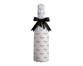 Bottle of Bangor wine gift wrapped in paper with a black ribbon on a white background