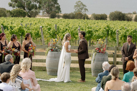 Wedding couple and guests at a Bangor wedding ceremony in the vineyard.