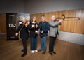 Matt and Vanessa Dunbabin from Bangor with TSO musicians Jenny Owen holding a violin and David Robins holding a Trombone.